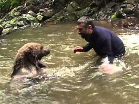 Outbrain Ad Example 65090 - [Photos] Mama Bear Does This After Man Saves Her Drowning Cubs